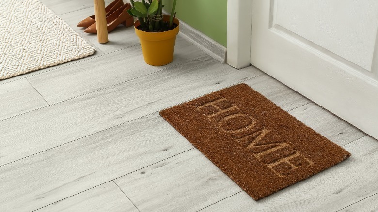 HOME mat on white floor