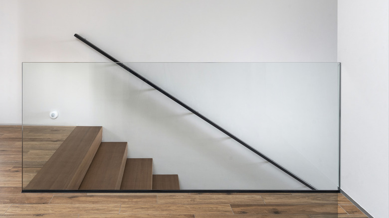 modern staircase with only handrail