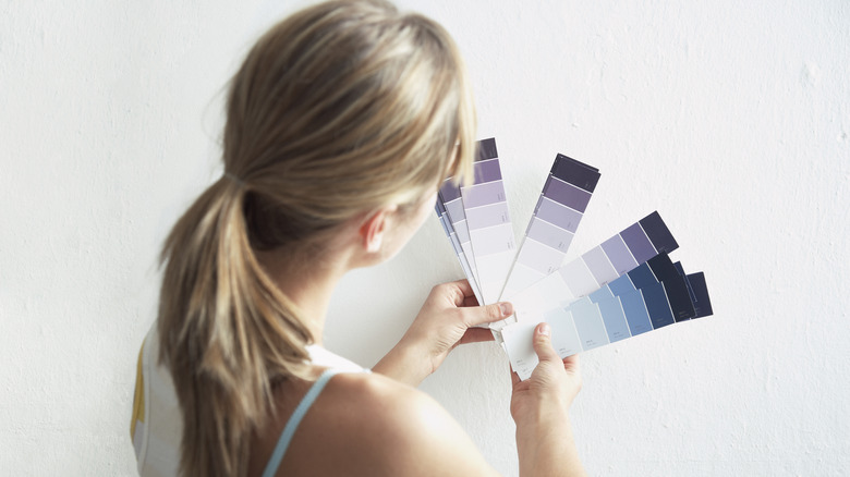 woman with paint swatches