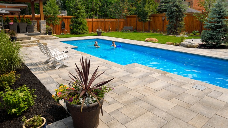 Pool surrounded by stone patio