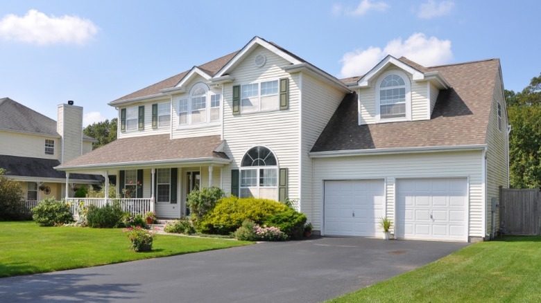 McMansion with green shutters 