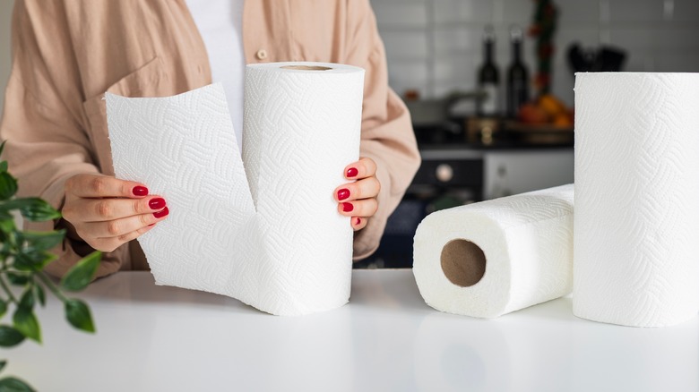 Woman tearing off paper towels