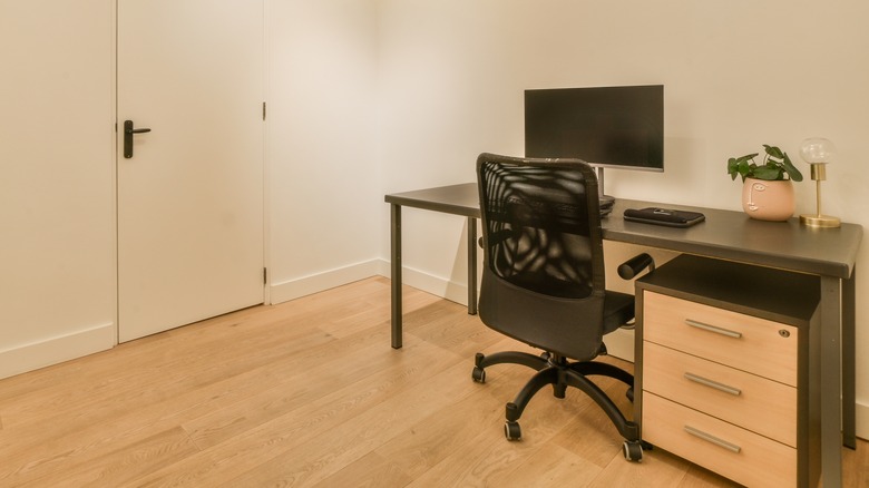 office with desk in basement of home