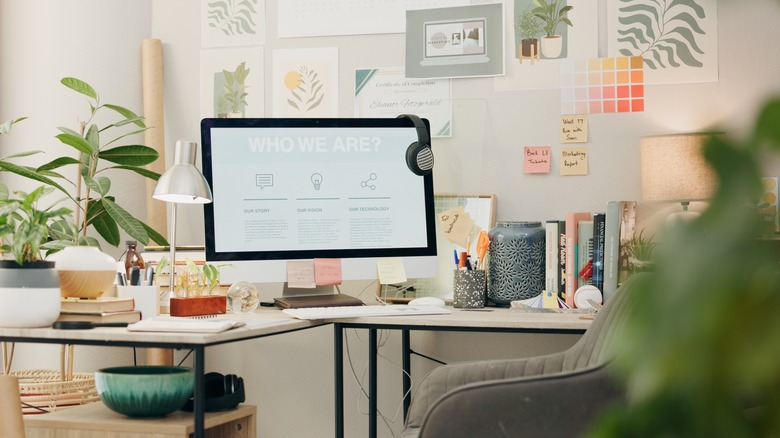 office space with plants and wall decor