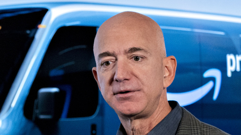 Jeff Bezos in front of Prime van