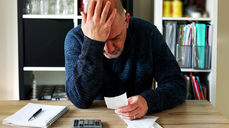 man worrying about budget