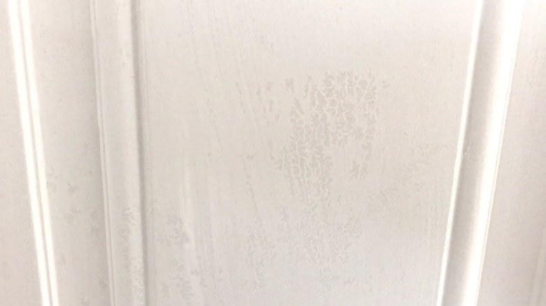 White paint cissing on door surface