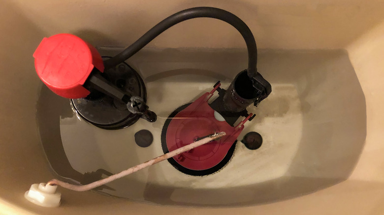 Toilet tank with lid off