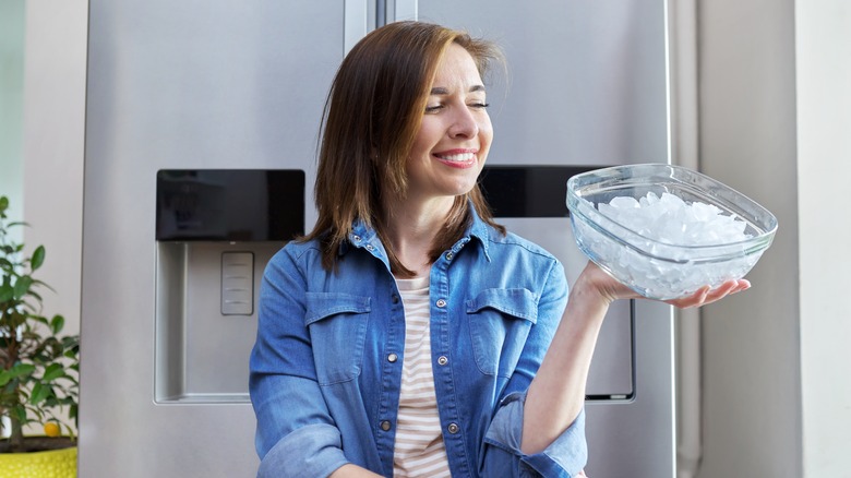 Woman holding a bowl of ice