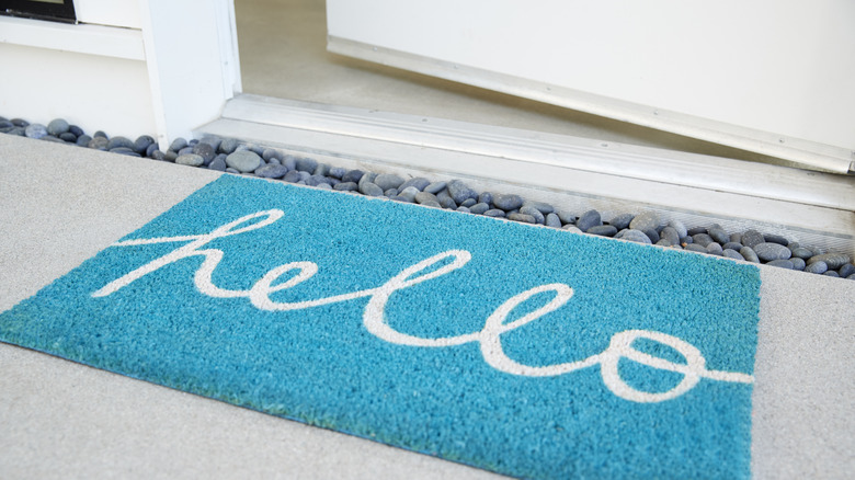 Door opening to hello doormat