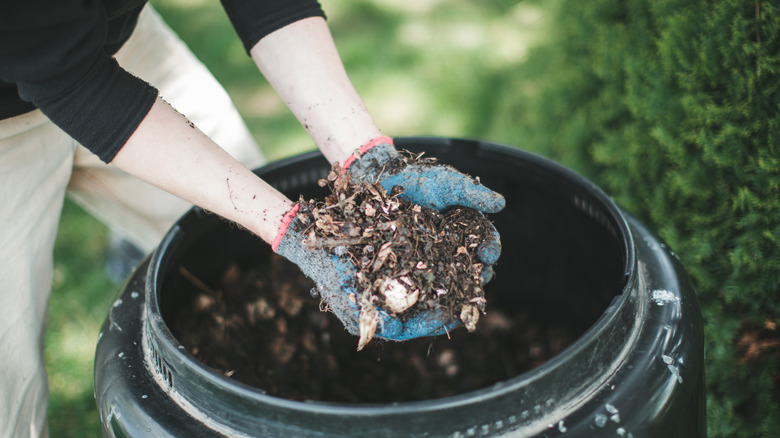 Man holding compost