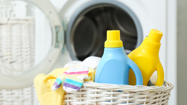 detergent bottle in laundry basket