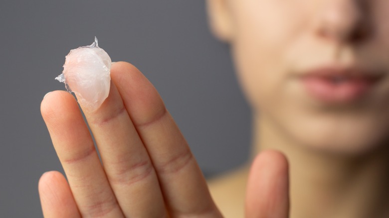 Petroleum jelly on fingers