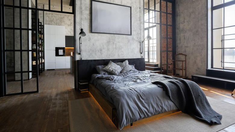 dark bedroom with metal railing