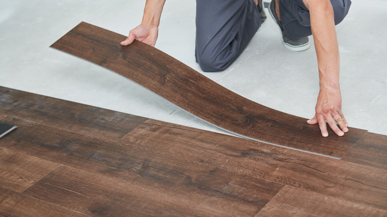 Person installing laminate flooring