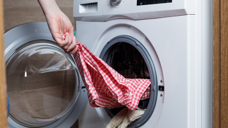 Taking shirt out of washer