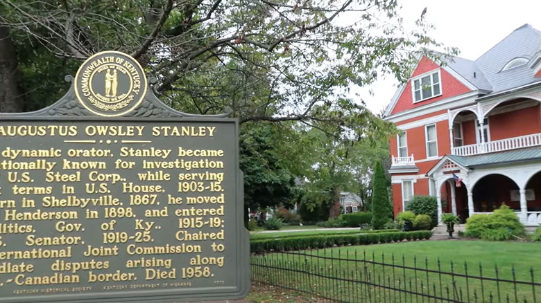 Historic home sign and house