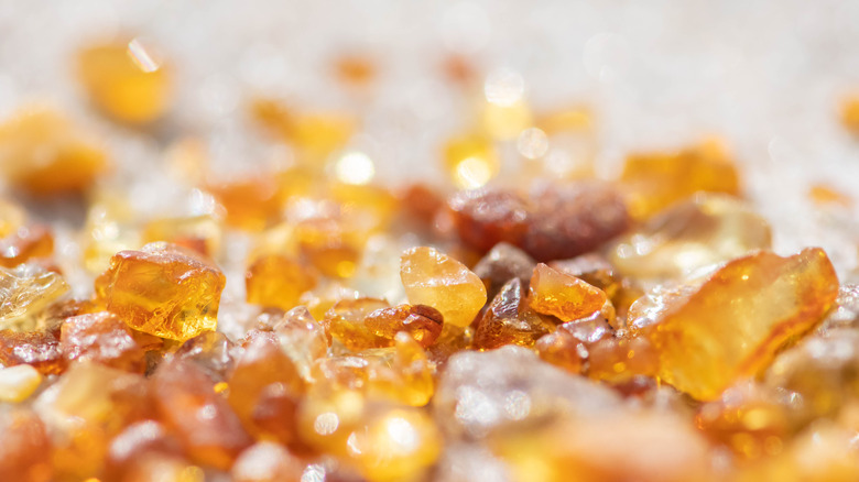 amber pieces in sand