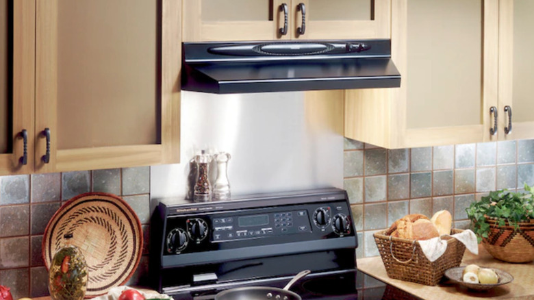 stainless steel backsplash behind stove