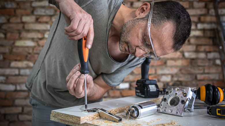 Man using screwdriver