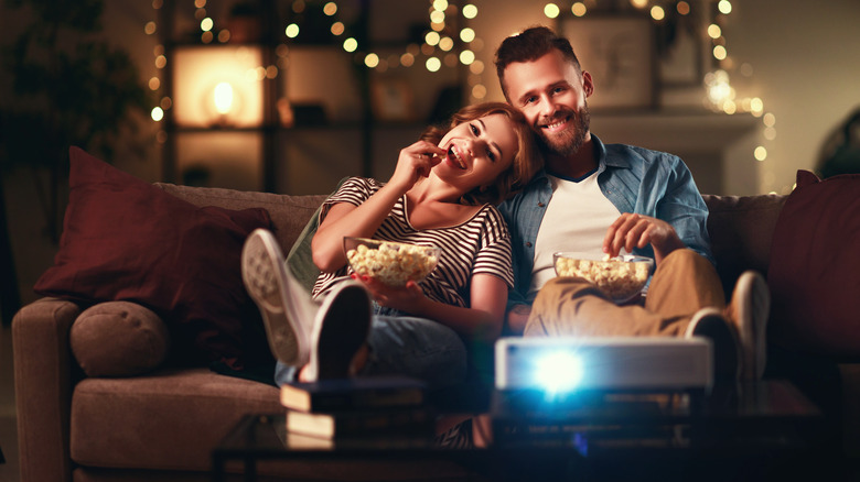 Couple watching a projector