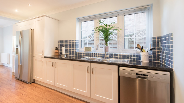 Fridge and window on wall