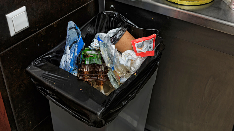 Almost full kitchen trash can