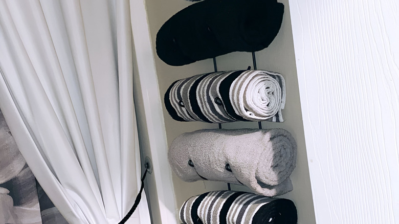 towels stored in wine rack