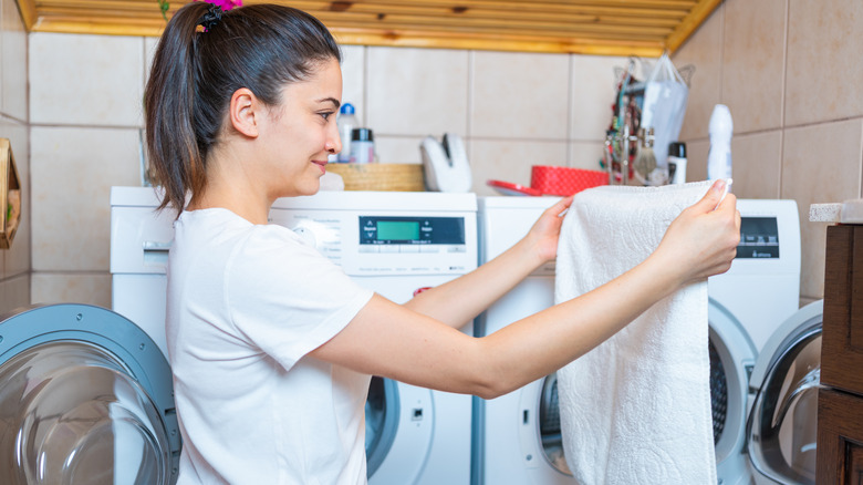 Woman looking at towel