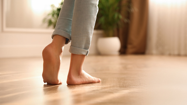 person walking on flooring