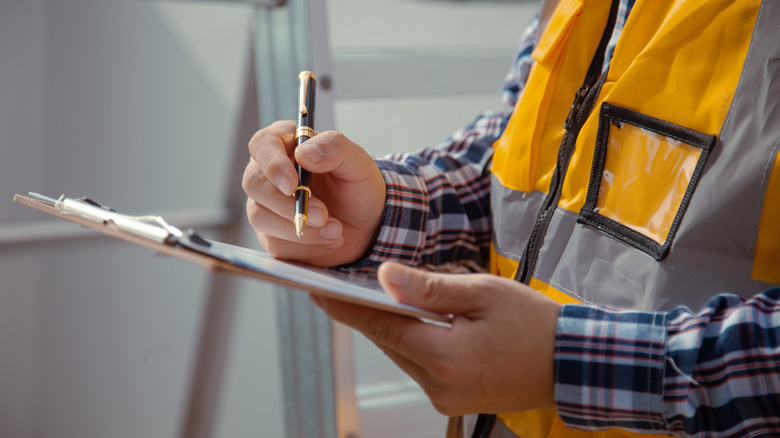 contractor filling out paperwork