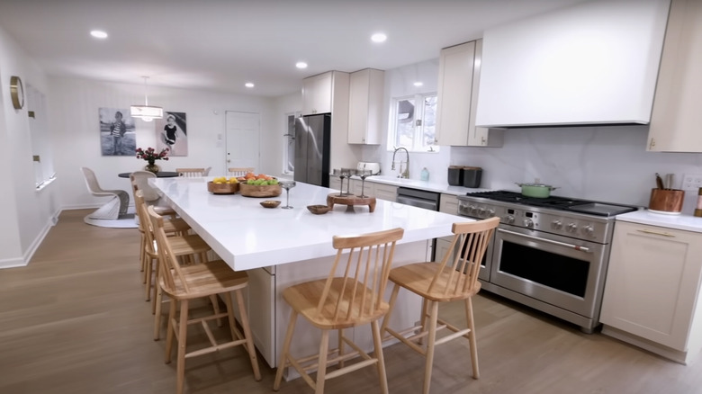 White kitchen with wooden chairs