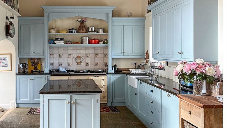 Kitchen with light blue cabinets