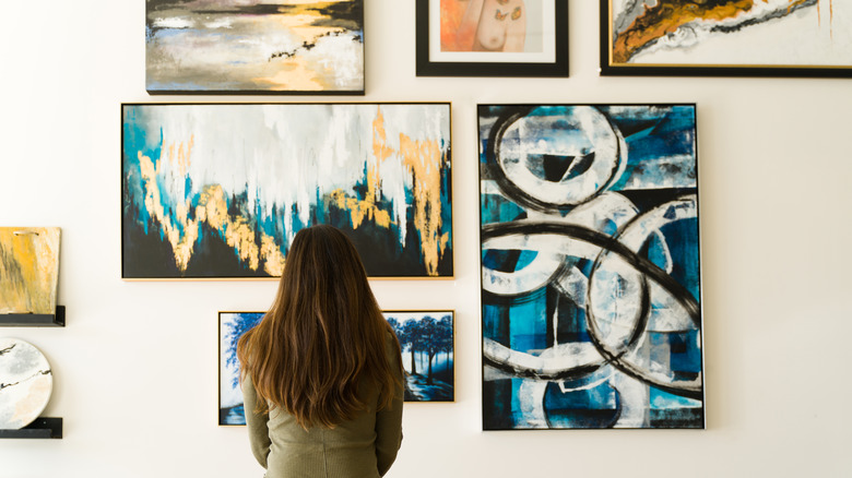 Woman looking at art