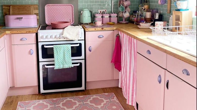 Kitchen with pink cabinets