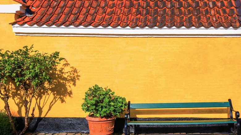 Yellow house with an orange roof