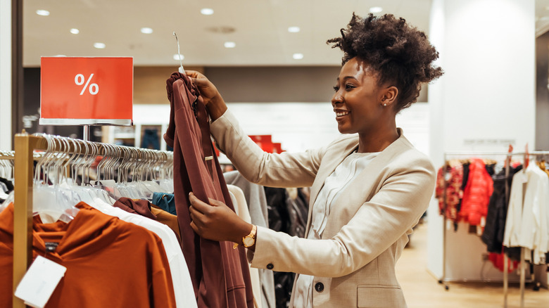 woman at sale rack