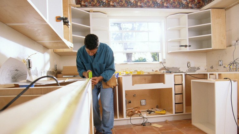 Person remodeling and renovating kitchen