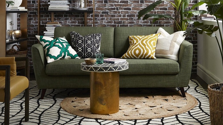 Green couch in boho room