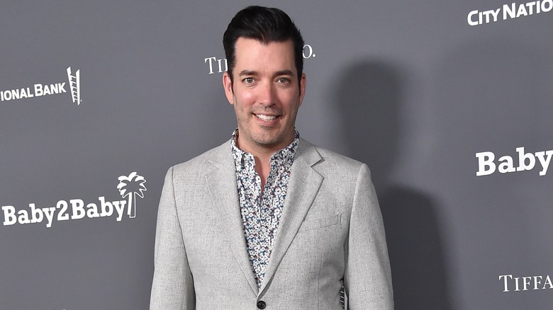 Jonathan Scott smiling on red carpet