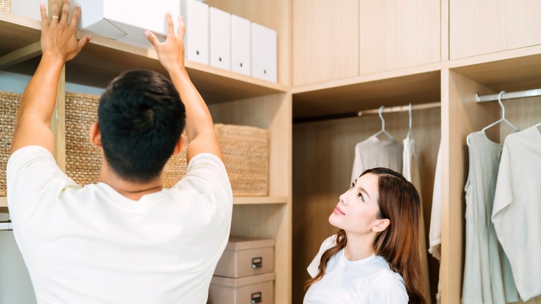 couple organizing closet