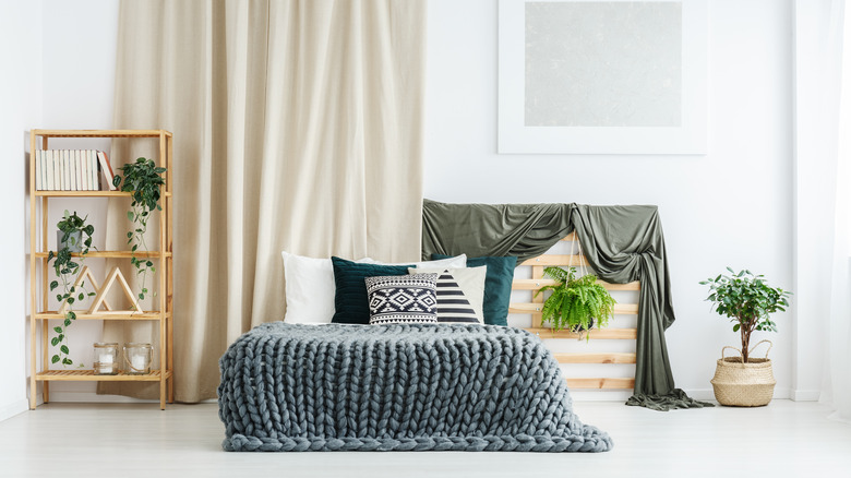 Bright white asymmetrical bedroom 