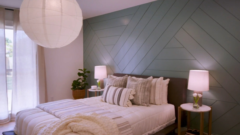 Blue wooden accent wall in bedroom