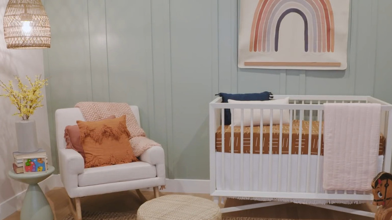 Nursery with green wall and light pink wall