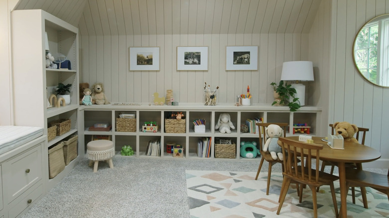 A nursery with shiplap wall