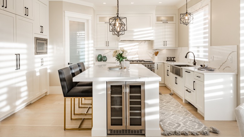 white kitchen island with wine fridge