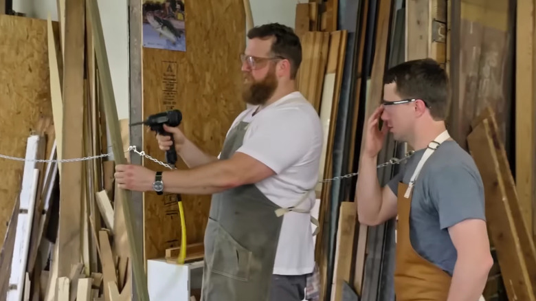 Ben Napier demonstrating how to use a reverse nail gun