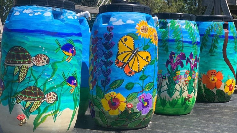 Rain barrels with mural art