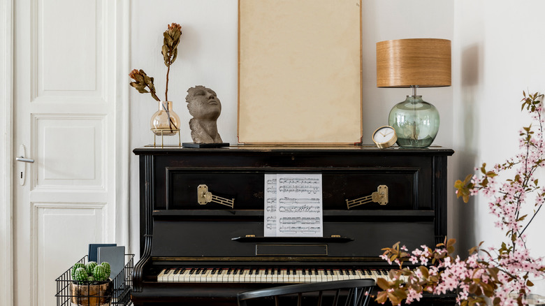 room with antique piano statement piece