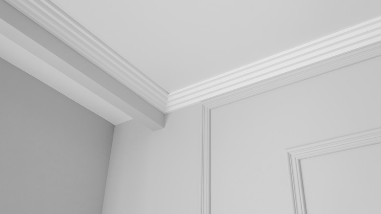 Gray wall and white ceiling with crown molding